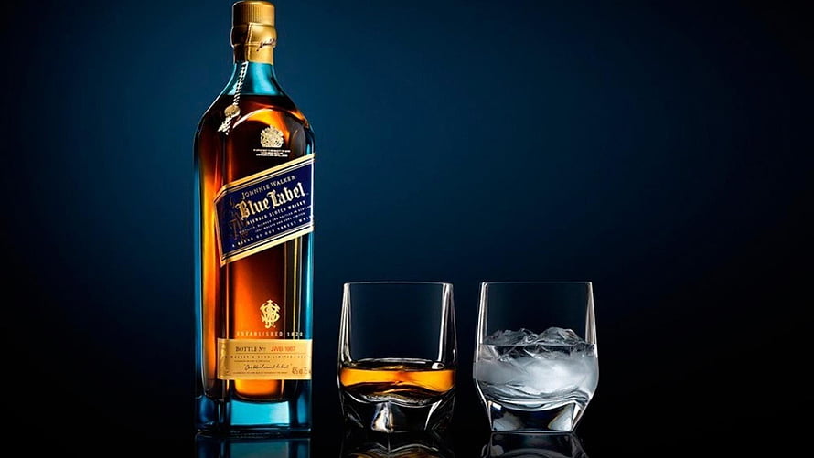 Johnnie Walker Blue Label Scotch Whiskey Bottle with Two Glasses and Ice on Dark Background HD wallpaper