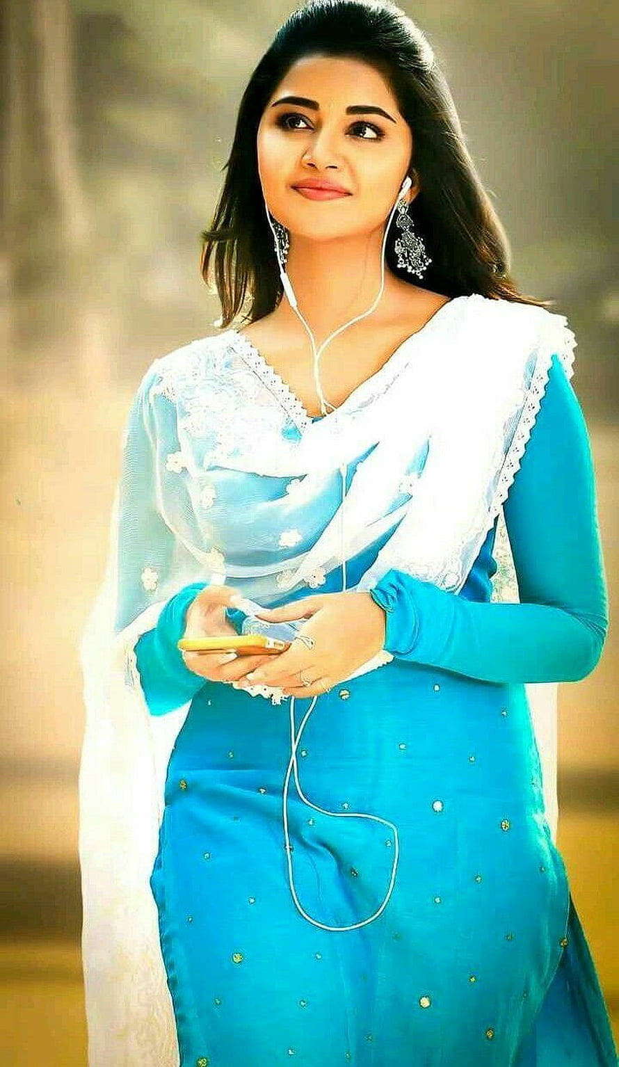 Anupama Parameswaran in a blue kurta with white dupatta and earphones HD phone wallpaper