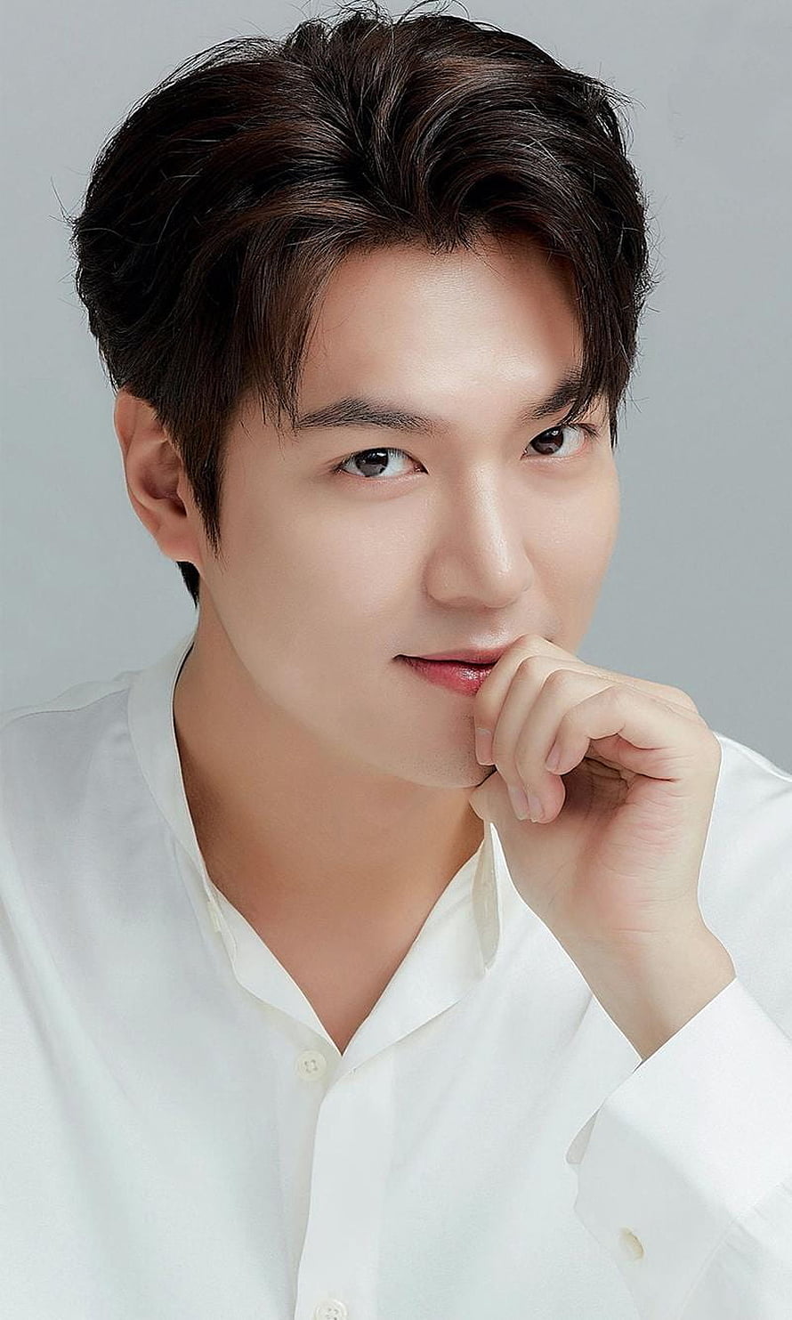 Korean Male Portrait in White Shirt with Hand on Chin HD phone wallpaper
