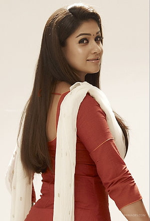 Nayanthara in a red salwar suit with white dupatta and long dark hair HD phone wallpaper
