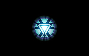 Glowing Arc Reactor Emblem on Black Background HD wallpaper