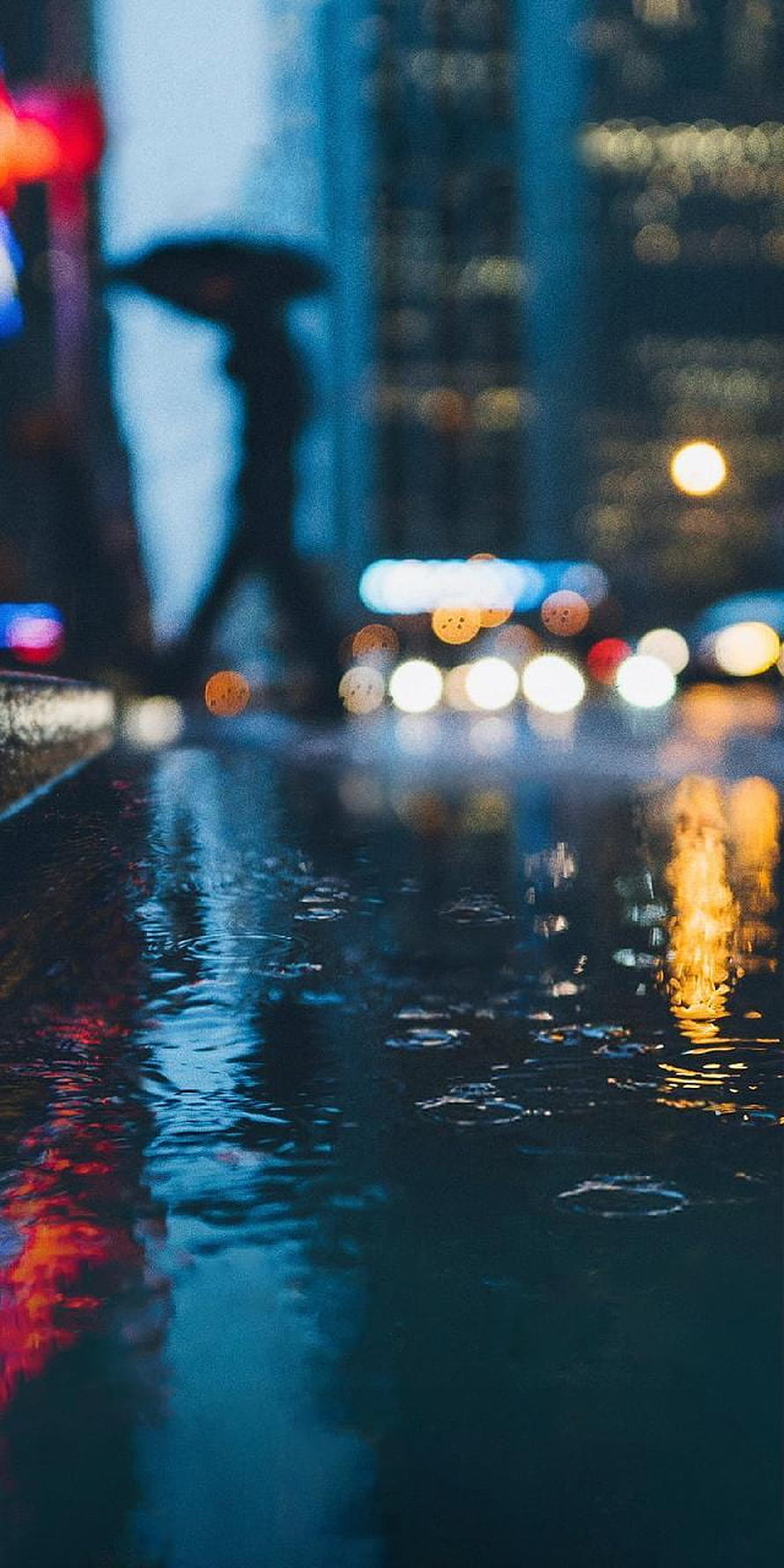 Moody Rainy Night City Street with Bokeh Lights and Wet Pavement Reflections HD phone wallpaper