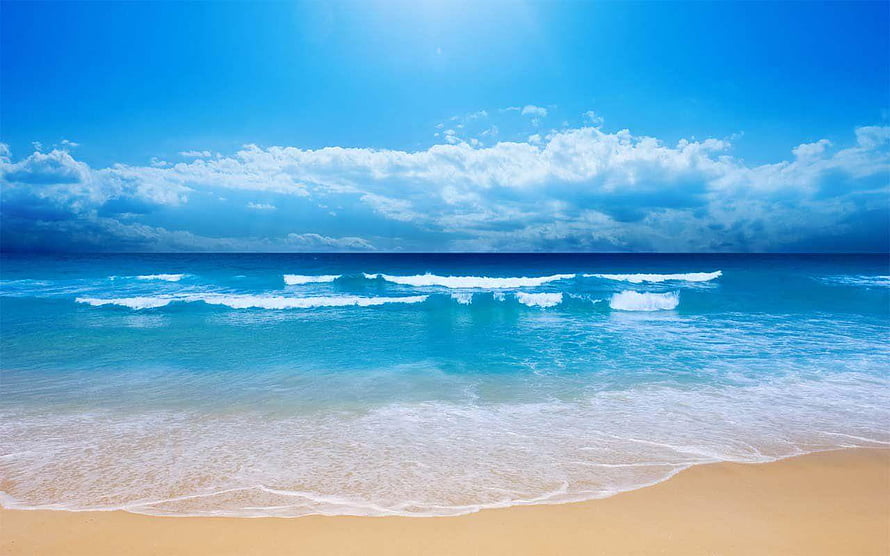 Serene Tropical Beach with Turquoise Waves and Golden Sand Under a Bright Blue Sky HD wallpaper