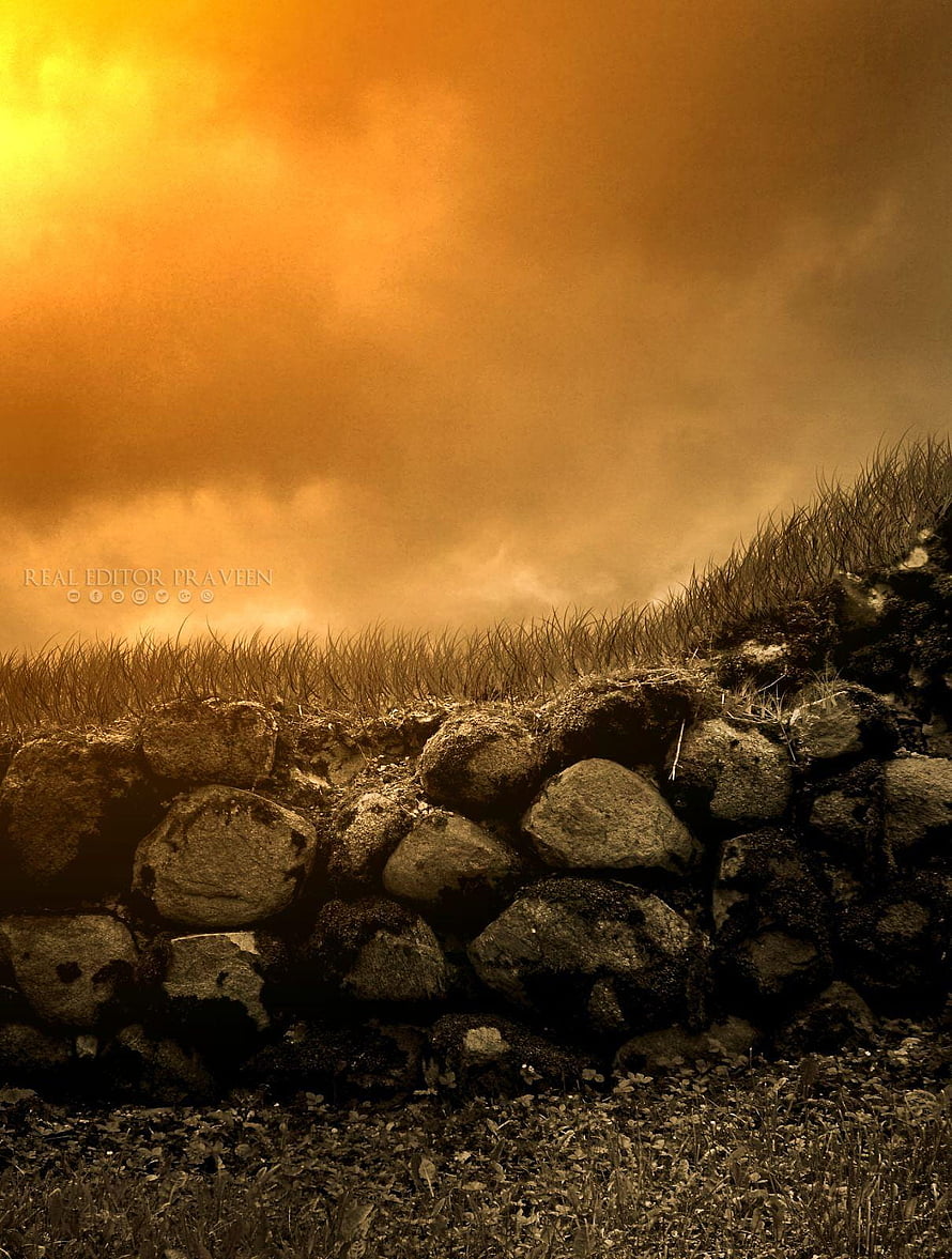 Dramatic Golden Sky Over Rustic Stone Wall and Wild Grass HD phone wallpaper
