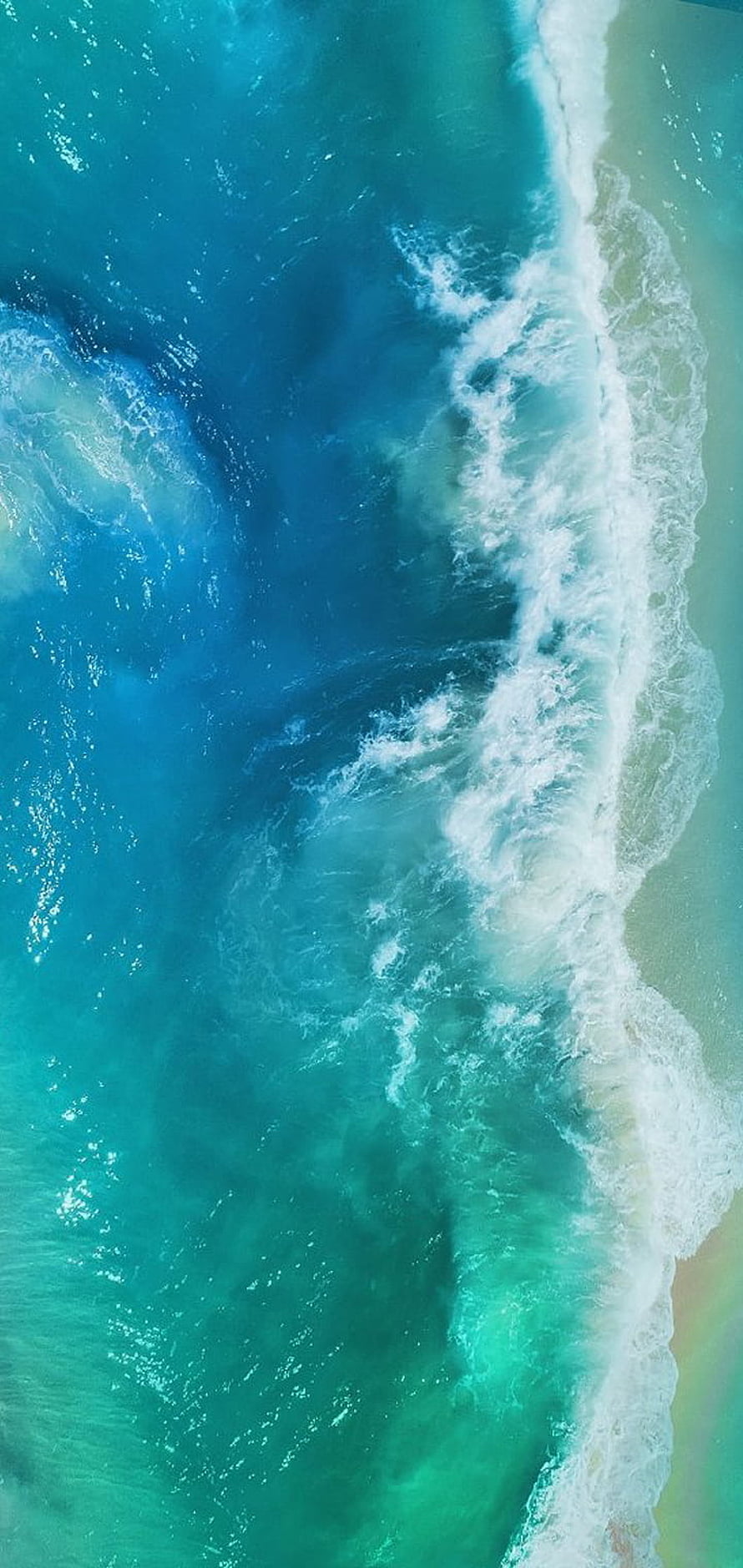 Aerial View of Turquoise Ocean Waves Crashing on Sandy Shore HD phone wallpaper