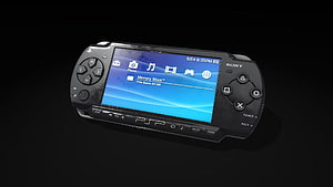 Sony PlayStation Portable PSP Handheld Console on Black Background HD wallpaper