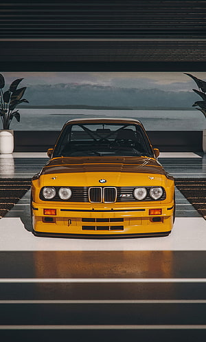 Front View of a Classic Yellow BMW E30 M3 Evo DTM Parked in a Modern Garage Setting HD phone wallpaper