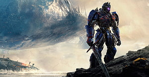 Optimus Prime from Transformers: The Last Knight Standing on a Rocky Cliff with a Massive Ship in the Background HD wallpaper