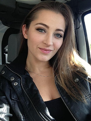 Dani Daniels in a black leather jacket with long brown hair and blue eyes HD phone wallpaper
