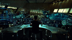 Tony Stark in the Iron Man 2 Workshop with Holographic Vehicle Schematics HD wallpaper