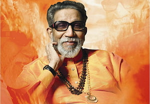 Bal Thackeray Portrait in Orange Kurta with Beaded Necklace and Glasses HD wallpaper