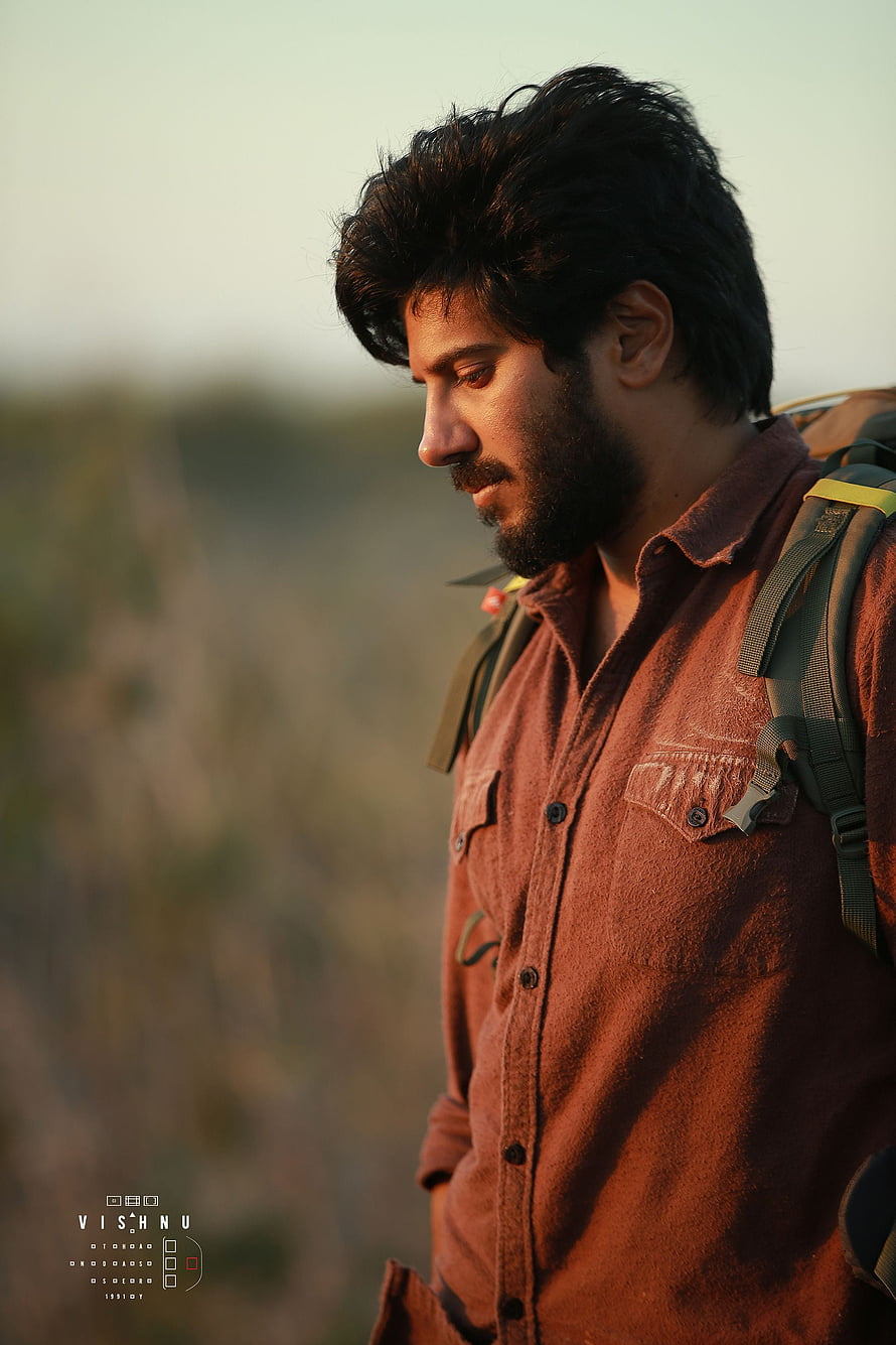 Man in Rust Shirt with Backpack in Golden Hour Profile Portrait HD phone wallpaper
