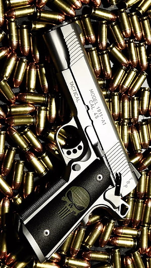 Tactical Model 1911-A1 Pistol Resting on a Bed of Brass Cartridges HD phone wallpaper