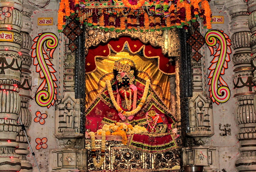 Shri Radha Sneh Bihari Temple Shrine in Vrindavan with Ornate Carvings and Floral Decorations HD wallpaper
