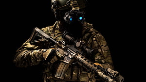 Special Forces Operator in Tactical Gear Holding an Assault Rifle Against a Black Background HD wallpaper