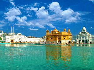 Golden Temple Amritsar Reflection in Sacred Pool Under Blue Sky HD wallpaper
