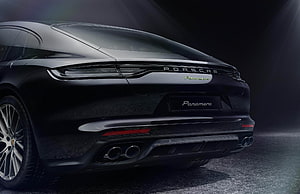 Rear View of Black Porsche Panamera 4 E-Hybrid with Quad Exhaust and LED Taillights HD wallpaper