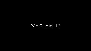 Minimalist Black Background with White Text Reading Who Am I HD wallpaper