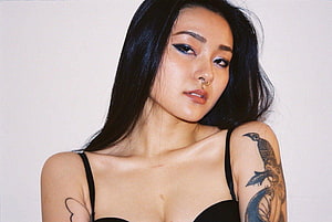 Rae Lil Black Portrait With Black Hair, Nose Ring, and Bird Tattoo on Shoulder HD wallpaper