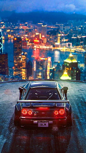 Black Toyota Supra MK4 Rear View Overlooking Neon Cityscape at Night HD phone wallpaper