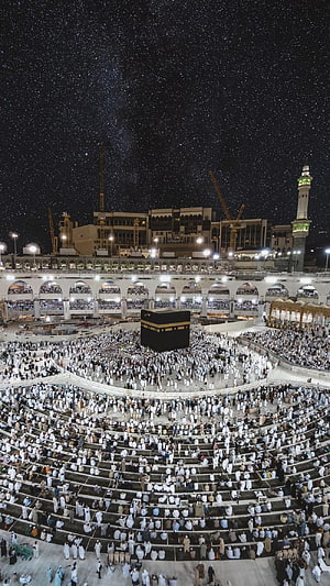 Massive Pilgrim Gathering at the Kaaba in Mecca Under a Starry Night Sky HD phone wallpaper