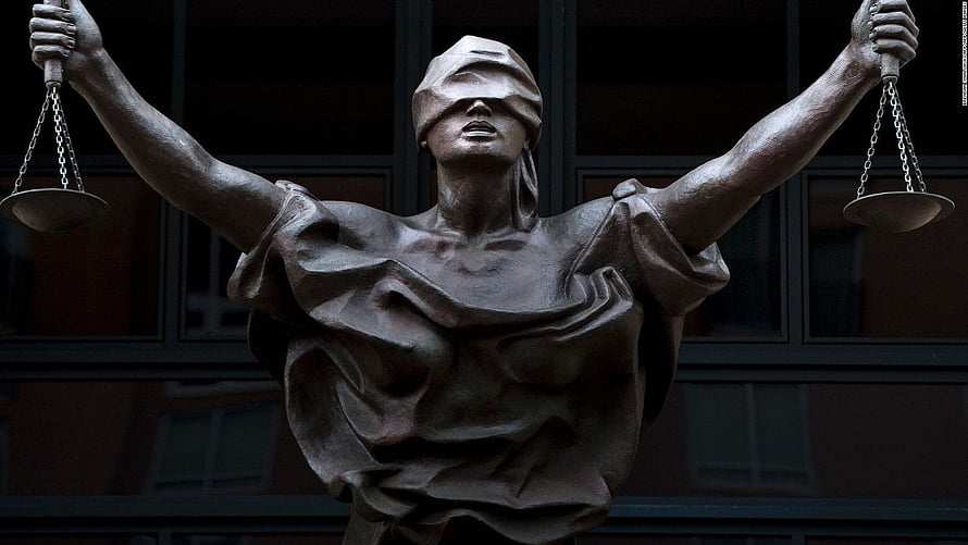 Blindfolded Lady Justice Statue Holding Scales of Law in Front of Court Building HD wallpaper