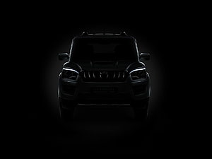 Mahindra Scorpio S11 Front View in Dramatic Black Lighting HD wallpaper