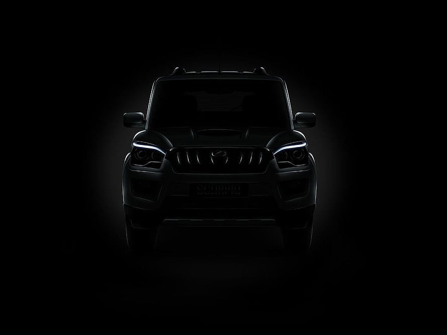 Mahindra Scorpio S11 Front View in Dramatic Black Lighting HD wallpaper