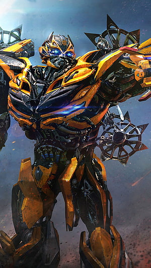 Bumblebee from Transformers in a battle-ready pose with glowing blue eyes and intricate mechanical armor HD phone wallpaper