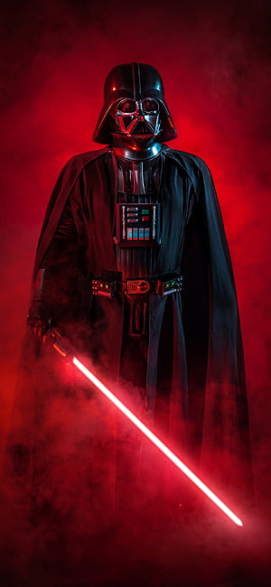 Darth Vader in Black Armor Holding a Red Lightsaber Amidst Dramatic Red Smoke HD phone wallpaper