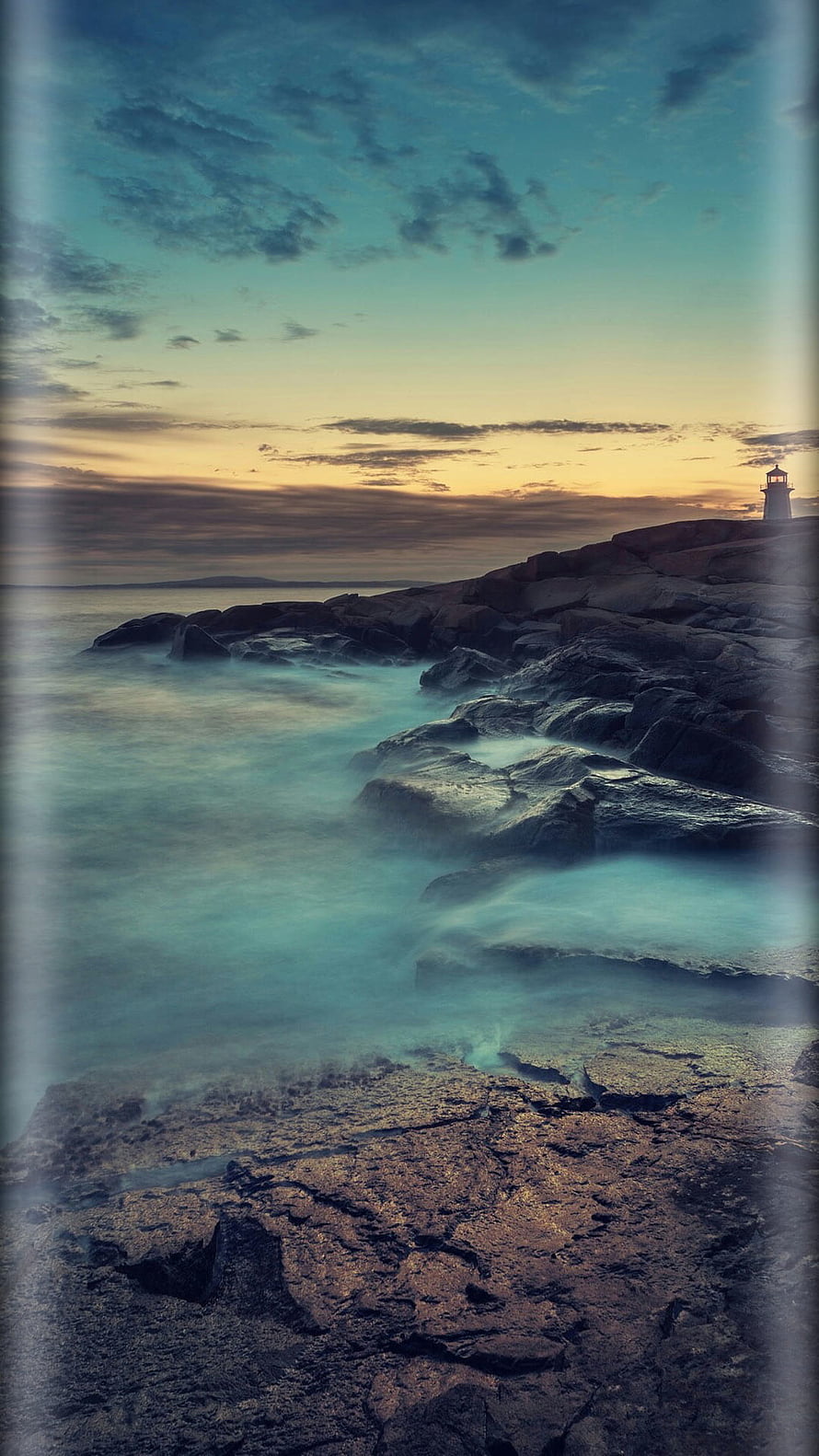 Long Exposure Coastal Lighthouse at Dusk with Misty Waves and Rocky Shoreline HD phone wallpaper