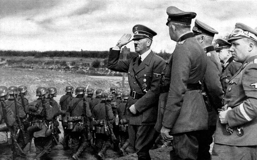 Adolf Hitler Saluting Troops During a Military Inspection in a Black and White Historical Photograph HD wallpaper
