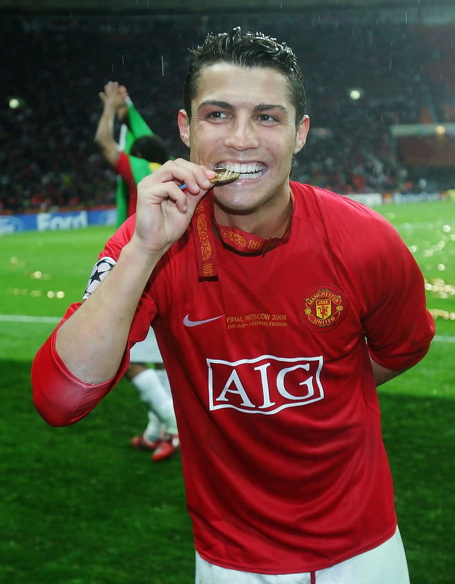 Cristiano Ronaldo Biting Gold Medal in Manchester United Kit at Champions League Final HD phone wallpaper