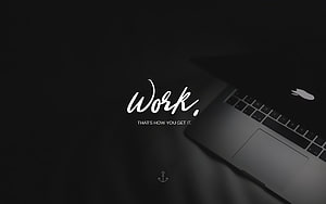 Minimalist Dark Laptop Workspace with Motivational Work Quote and Anchor Icon HD wallpaper