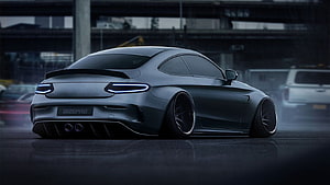 Sleek Matte Black Sports Coupe with Neon Taillights in Urban Night Setting HD wallpaper