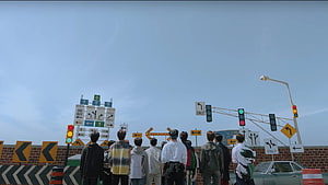 Seventeen Members Standing at a Crossroads with Traffic Signs and Signals HD wallpaper