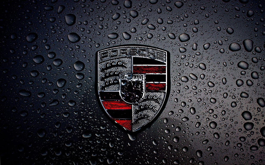 Porsche Emblem on Wet Black Surface with Rain Droplets HD wallpaper