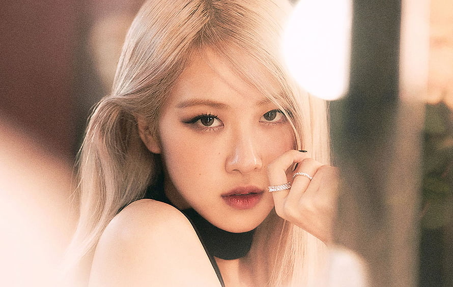 Rosé from BLACKPINK in a soft-focus portrait with platinum blonde hair and delicate jewelry HD wallpaper