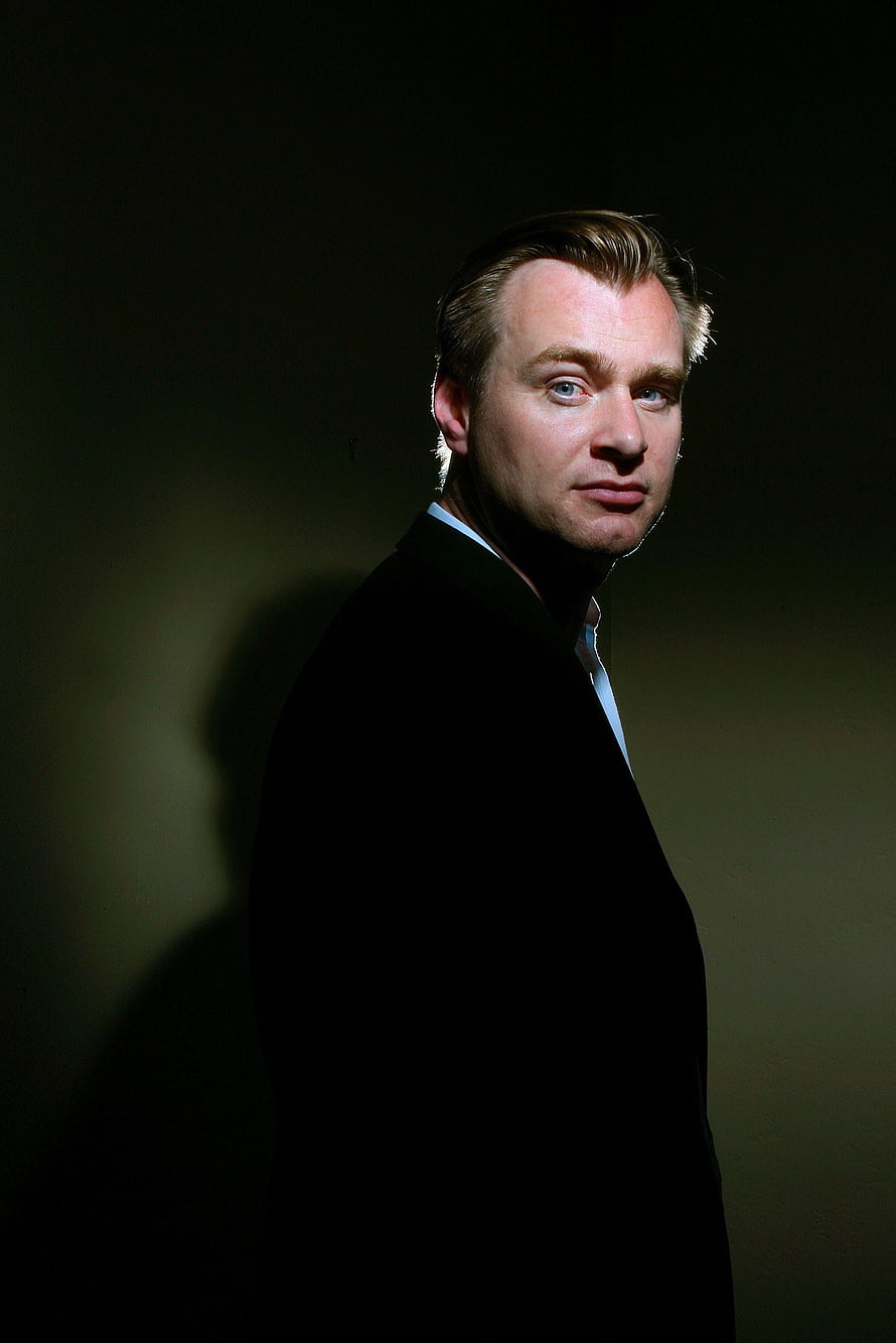 Christopher Nolan Dramatic Studio Portrait in Black Suit Against Dark Background HD phone wallpaper