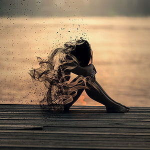 Silhouette of a girl dissolving into smoke on a wooden dock at sunset HD phone wallpaper