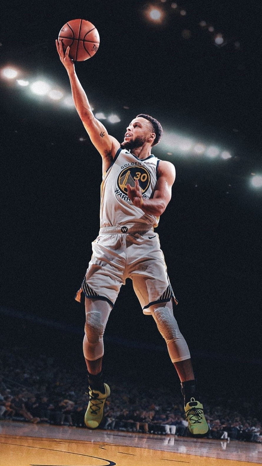 Stephen Curry in Golden State Warriors uniform shooting a basketball under arena lights HD phone wallpaper