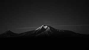 Monochrome Snow-Capped Mountain Peak in Dramatic Black and White Landscape HD wallpaper