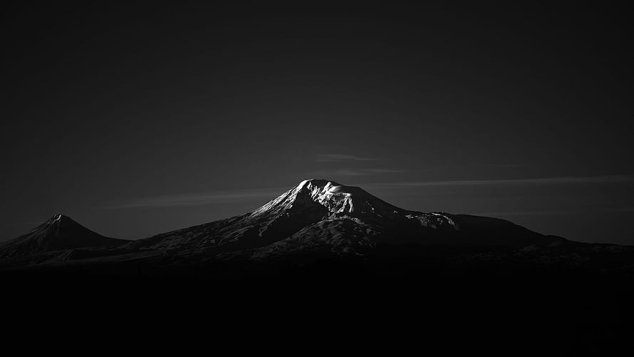 Monochrome Snow-Capped Mountain Peak in Dramatic Black and White Landscape HD wallpaper