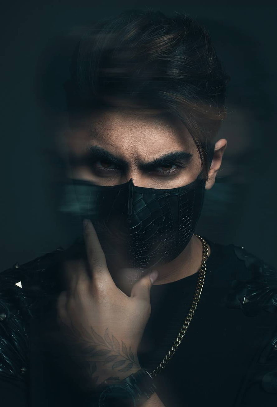 Intense Portrait of a Young Man Wearing a Black Face Mask and Gold Chain HD phone wallpaper