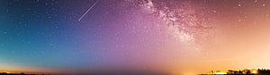 Panoramic Night Sky with Milky Way, Shooting Star, and Warm Horizon Glow HD wallpaper