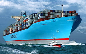 Eugen Maersk Container Ship Sailing on the Open Ocean with Pilot Boat HD wallpaper
