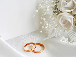 Elegant Rose Gold Wedding Rings with White Roses and Pearls on Silk HD wallpaper