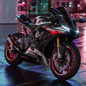 Yamaha R1M Superbike with Carbon Fiber Bodywork and Red Accents in Neon City Setting HD phone wallpaper