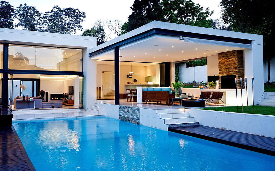 Modern Luxury Villa with Infinity Pool and Open-Air Living Space at Dusk HD wallpaper