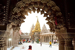 Kashi Vishwanath Temple View Through Intricate Carved Archway in Varanasi HD wallpaper